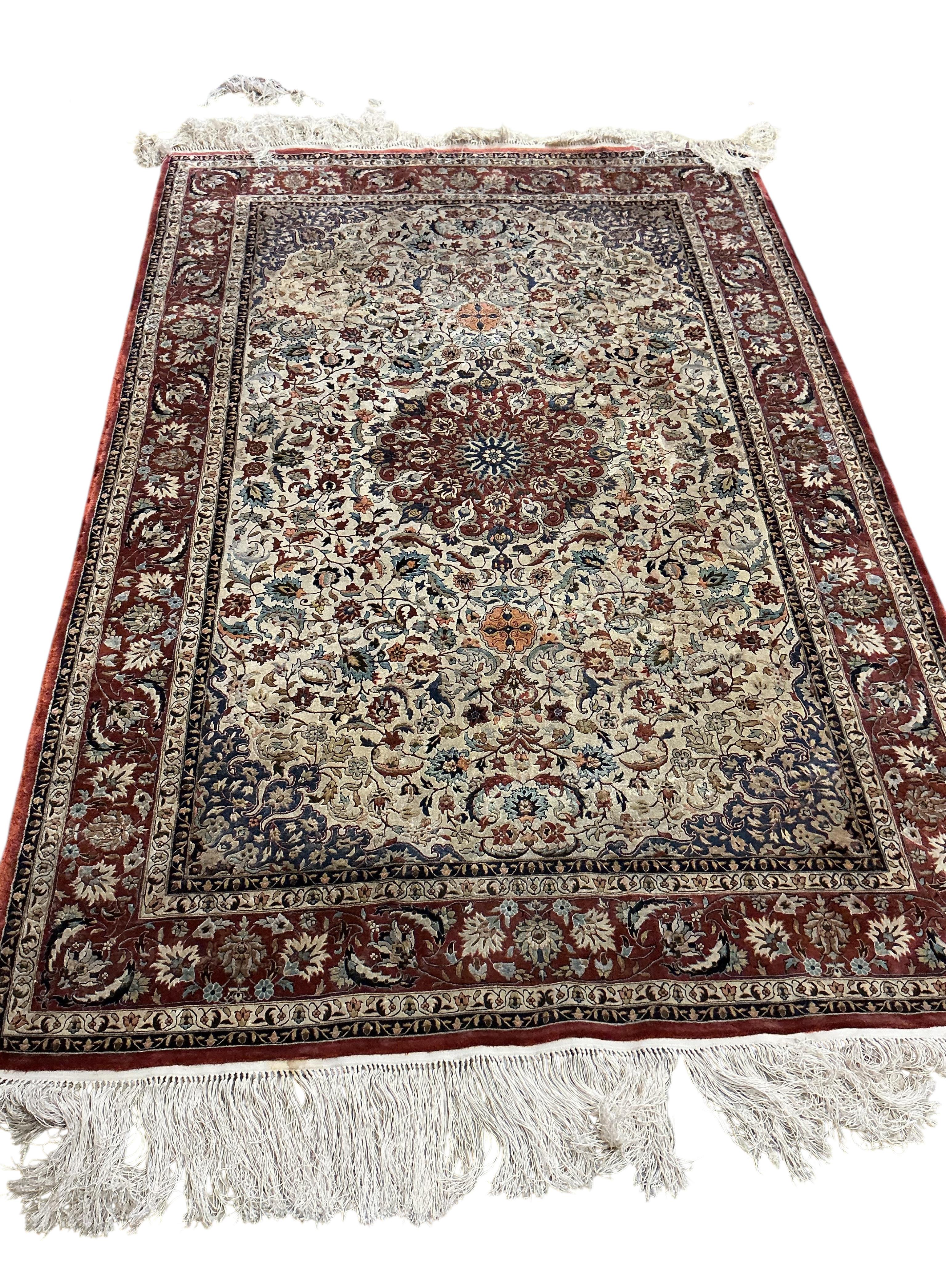 A North West Persian part silk ivory ground rug, 184 x 126cm